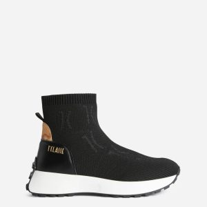 Running a calza in maglia jacquard Monogram Nere